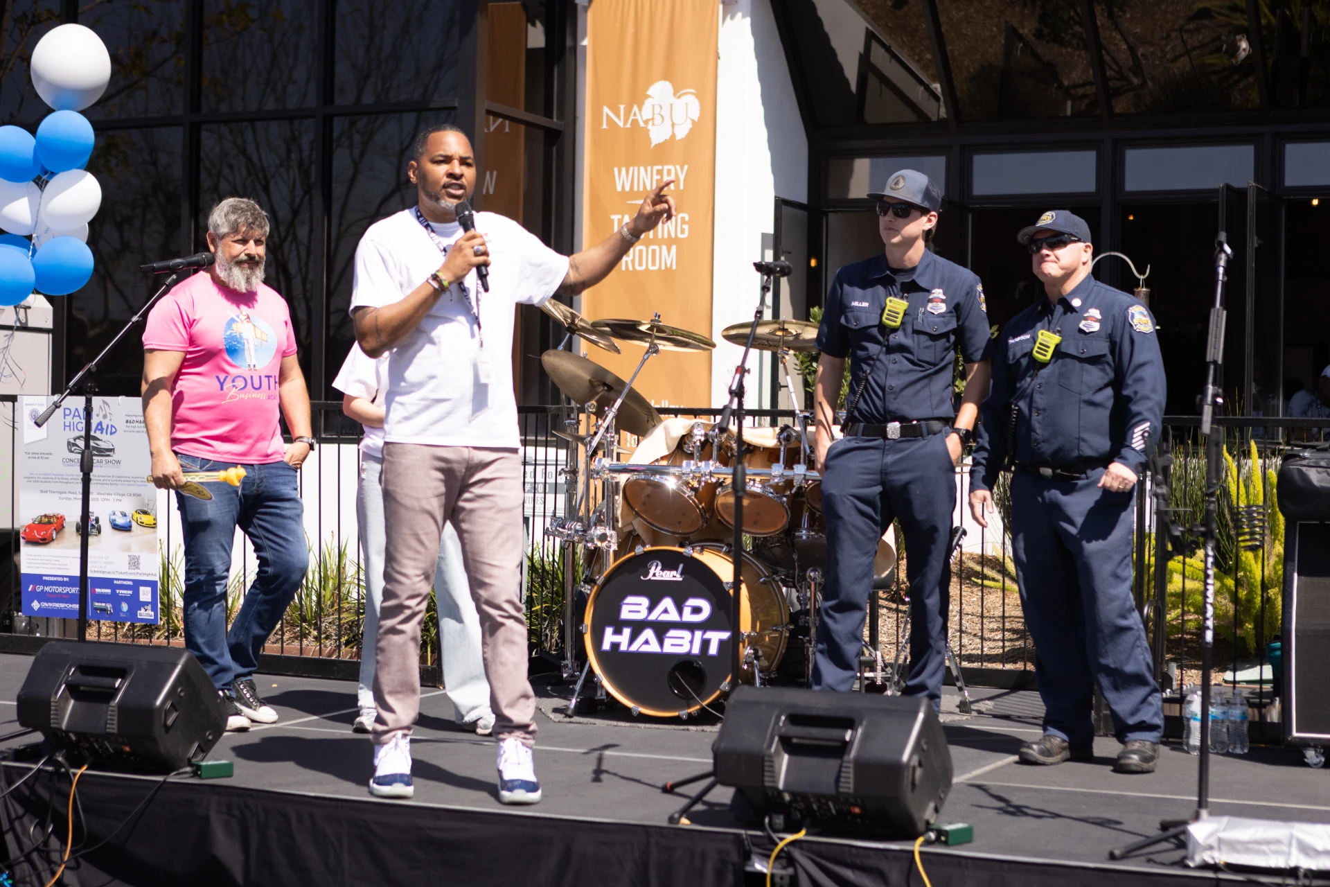 Rob Cook onstage at a military and community event