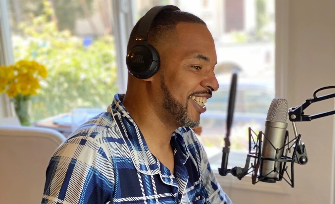 Rob Cook smiling during a podcast recording